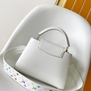 Alternative view of p1300•Taurillon cowhide leather•Cowhide leather trim•Cowhide leather lining•Metal hardware•Flap can be positioned inside or outside•Internal divider•Zippered inner pocket•Inner slip pocket•Key pouch•Padlock•Metal studs